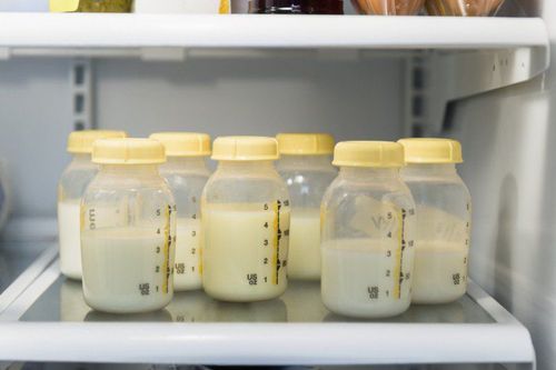 At what temperature should breast milk be thawed?