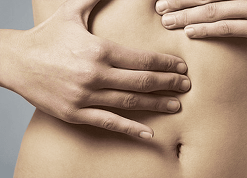 What disease is a hard, painless lump in the lower right abdomen a sign of? 