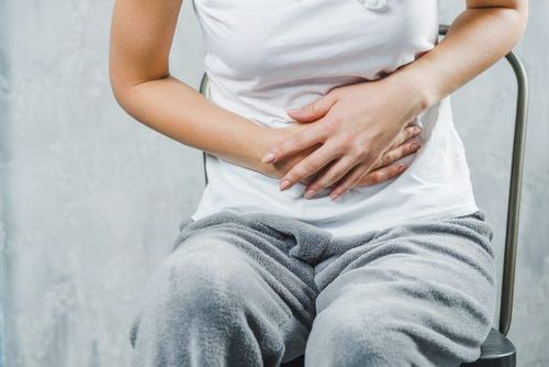 What is postprandial abdominal pain accompanied by loose stools?