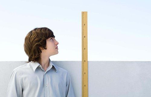 How much taller do children have to grow at puberty to "escape" short?