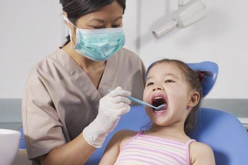 When should children go to the dentist?