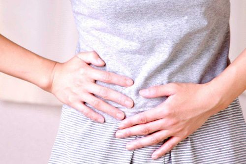 What is lower abdominal pain spreading to the back?